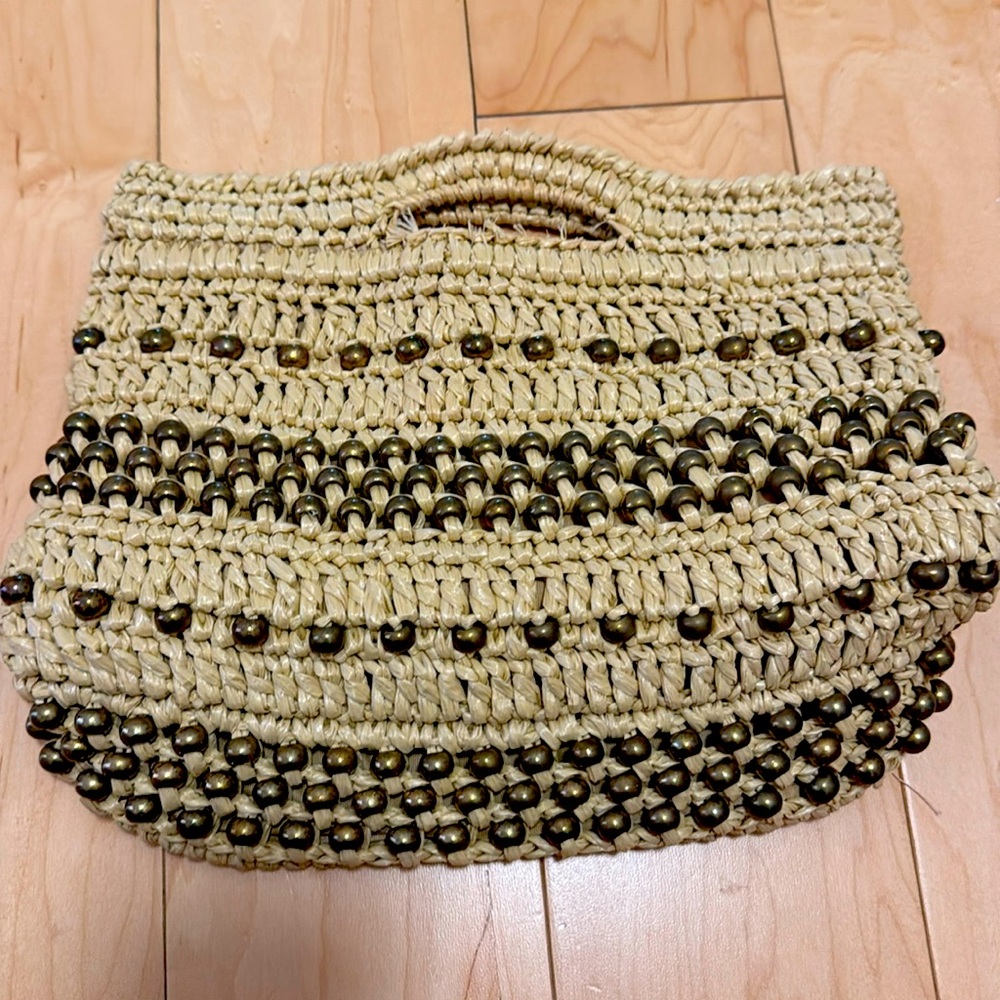 Handwoven bag with metal bead detail